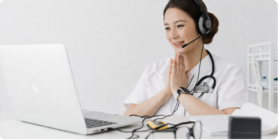 Doctor offering online support with a headset